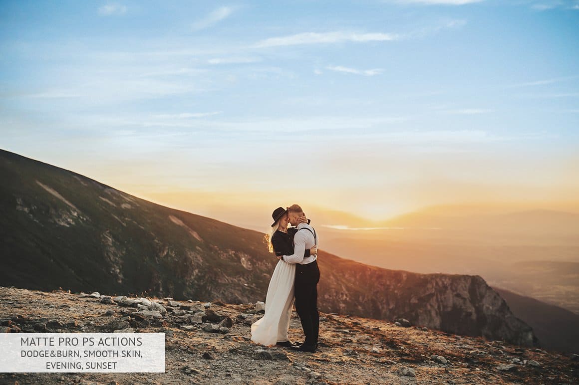 A couple in black and white clothes embrace on a mountain using the Matte Pro effect.
