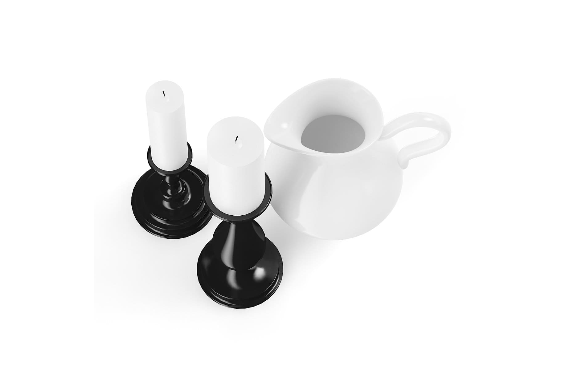 A white porcelain mug stands next to white candles.
