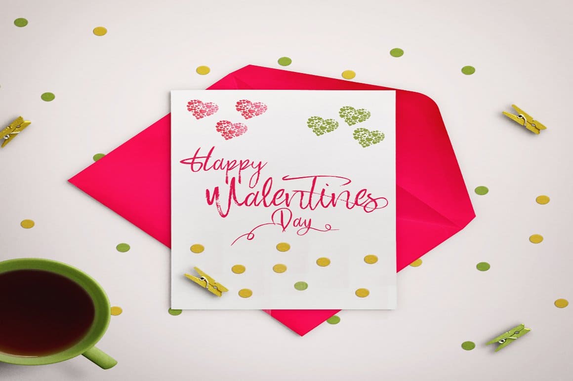 On the pink envelope is a postcard with the words Saturday "Happy Valentines Day" written on it.