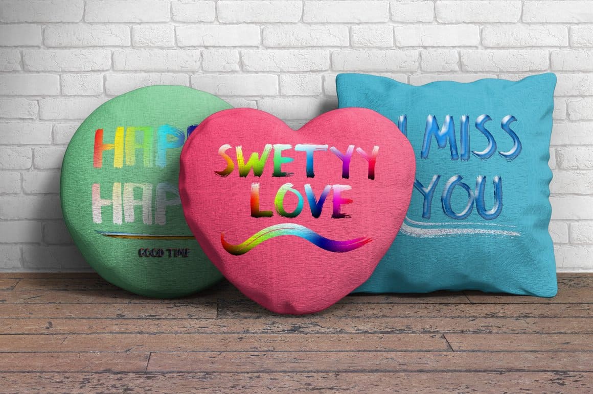 Green, pink and blue pillows with colorful romantic inscriptions.