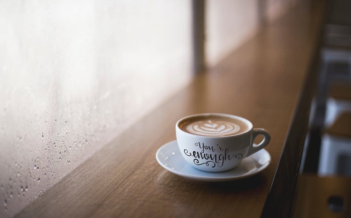 Image of coffee in a white cup with the inscription "You'r enough".