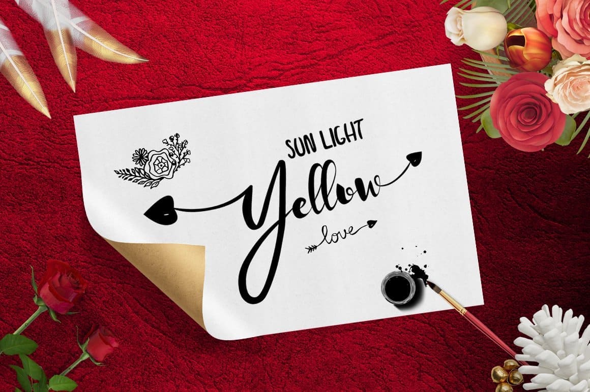 Roses and the inscription “Sun light yellow love” in La Alorta font are drawn on a white sheet of paper.