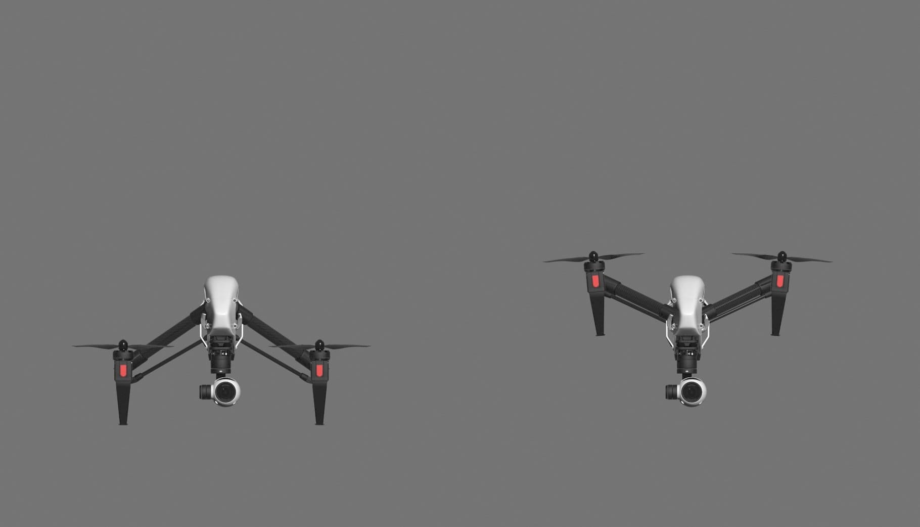 Two quadcopters are depicted on a gray background.