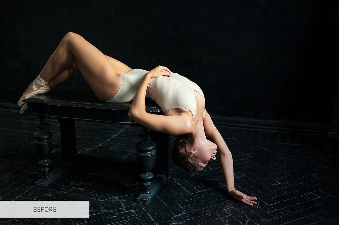 Photo of a ballerina gracefully lying on a bench.