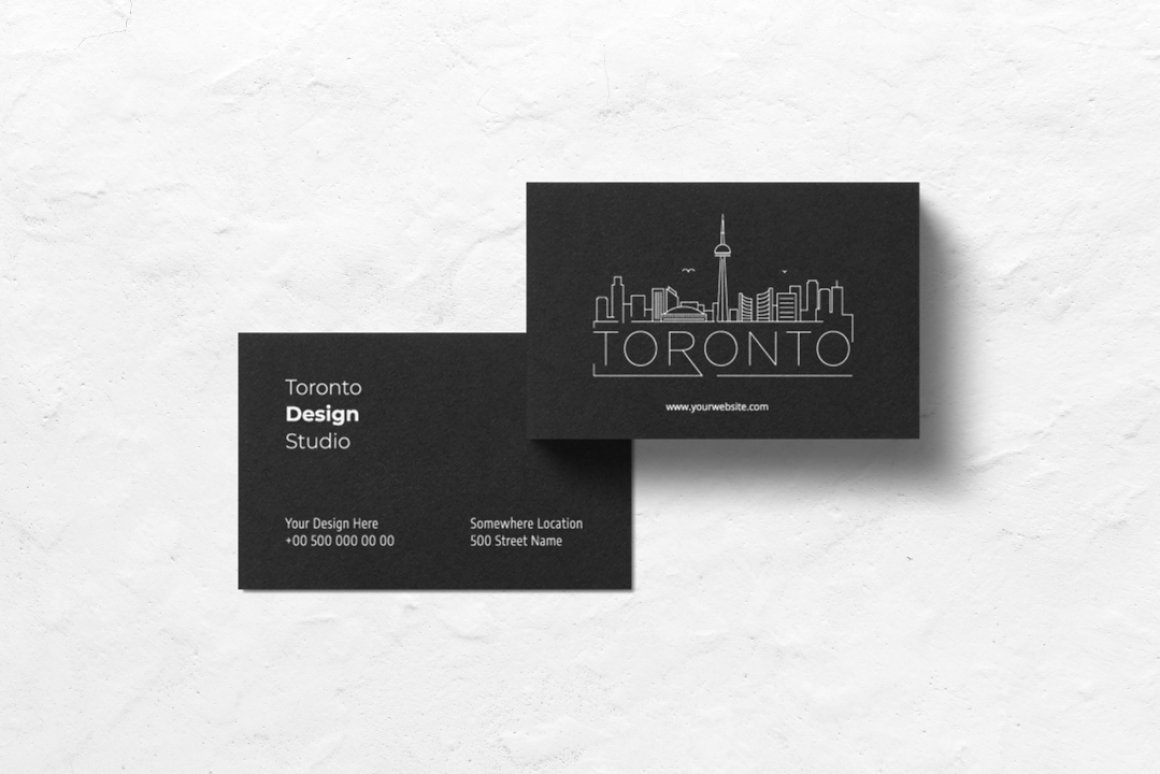 Black business cards with charms and more.