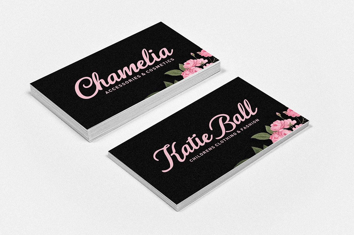 Black business cards with pink font.
