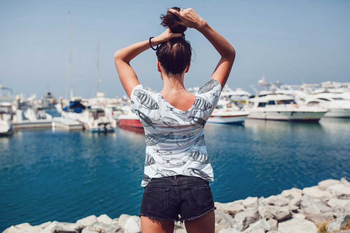 White sweater of a girl in shorts.