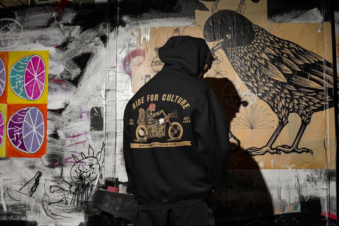 A golden motorcycle with a motorcyclist and the inscription "Ride for culture" are painted on the boy's black jacket.