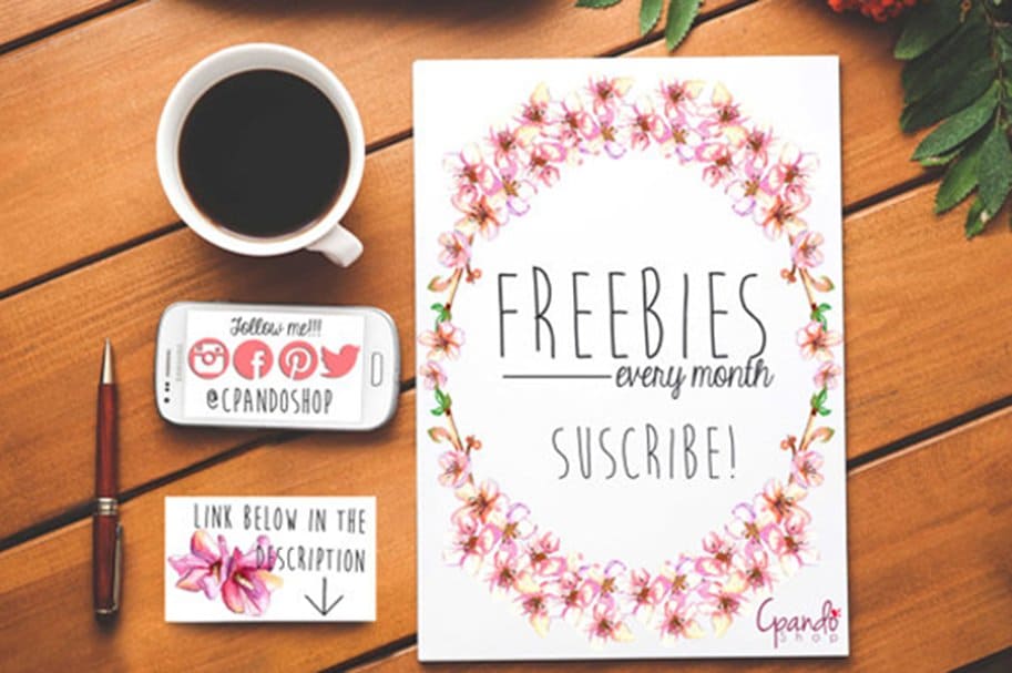 A frame of flowers is drawn on a white sheet, and the inscription "Freebies every month subscribe" is written in the middle.