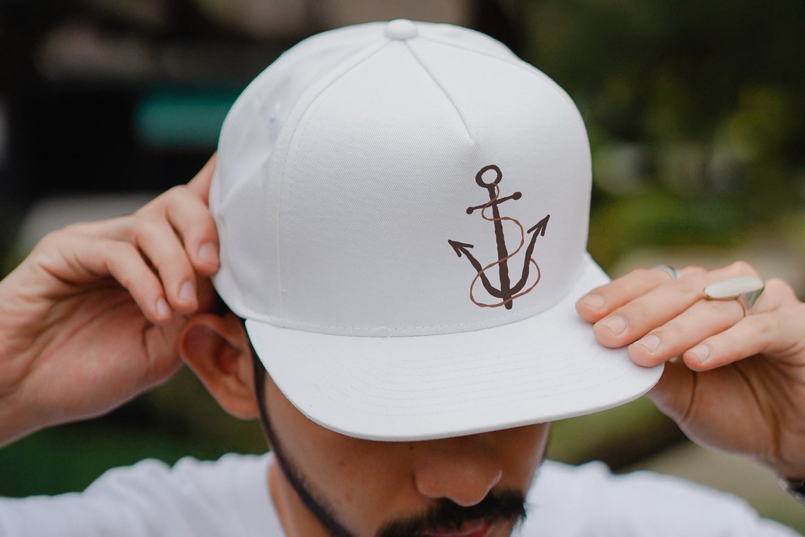 Anchor on a white cap.